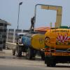 A man fills water in to the Lorry in filling station at Marina in Chennai
